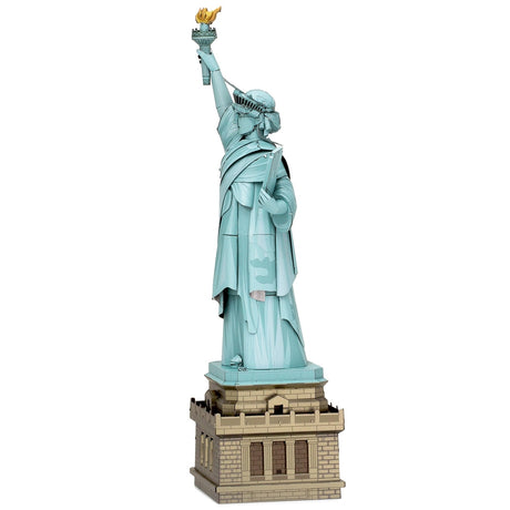 Metal model of the Statue of Liberty on a white background