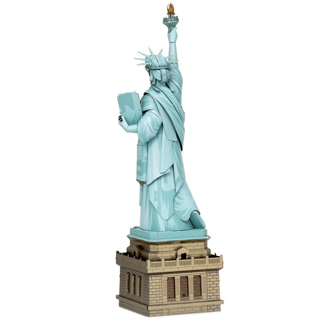 Metal model of the Statue of Liberty on a white background