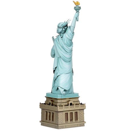 Metal model of the Statue of Liberty on a white background