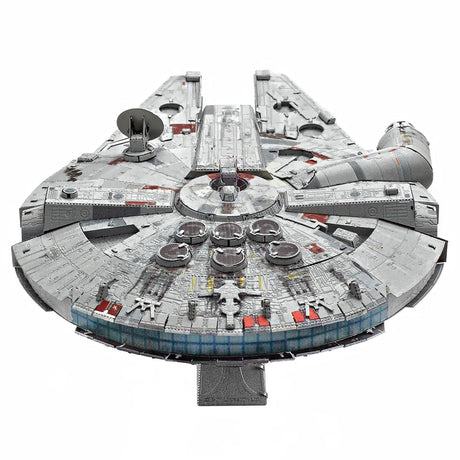 Metal model of the Millennium Falcon spaceship on a white background