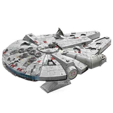 Metal model of the Millennium Falcon from Star Wars on a white background