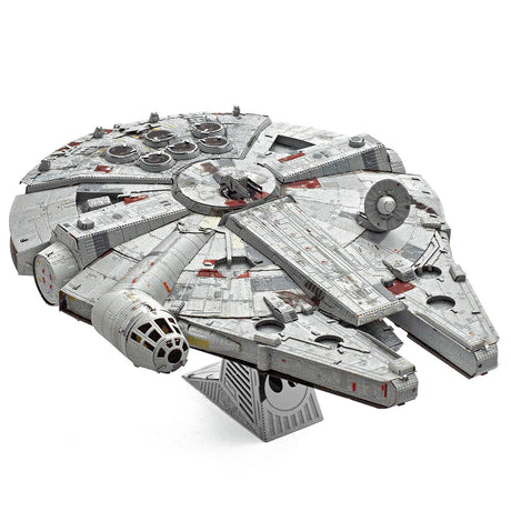 Metal model of the Millennium Falcon spaceship on a white background