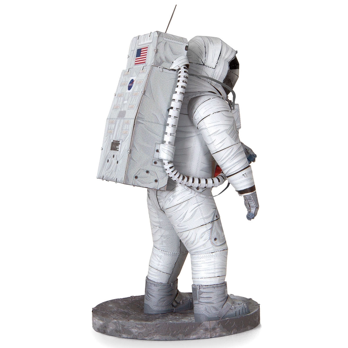 Metal models of a Apollo 11 Astronaut in a space suit with a white background