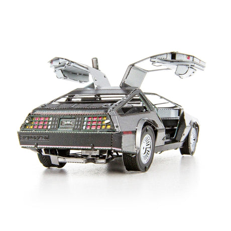 Metal model of a DeLorean car with open doors on a white background