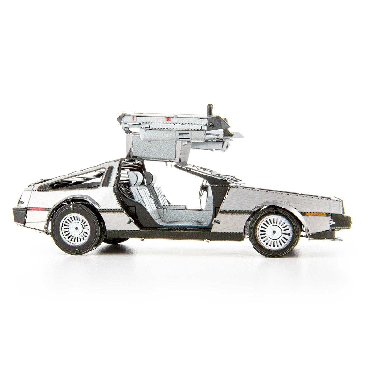 Metal model of a DeLorean car with a white background
