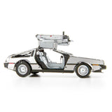 Metal model of a DeLorean car with a white background