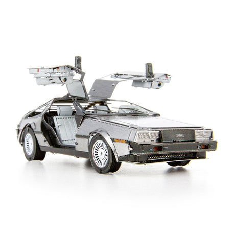 Metal model of a DeLorean car with open doors on a white background
