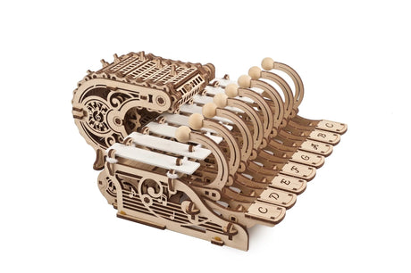 Mechanical Celesta wooden model kit on a white background