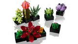 Colorful 10309 LEGO® Succulents on black bases against a white background