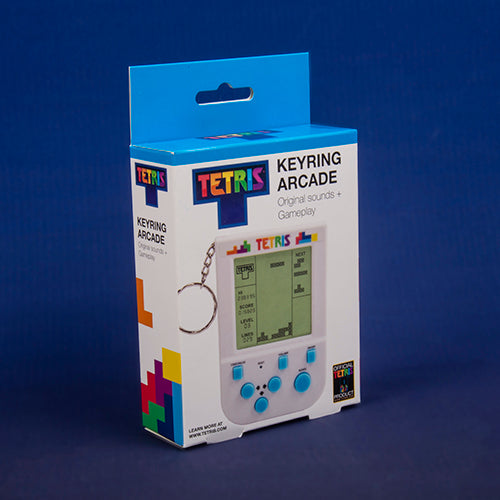 Tetris keyring arcade device packaging on a blue background