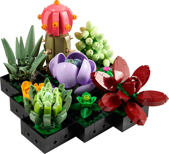 Colorful LEGO succulent plants on a black baseplate with a white background