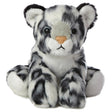 Plush toy snow leopard with black and white pattern on a white background