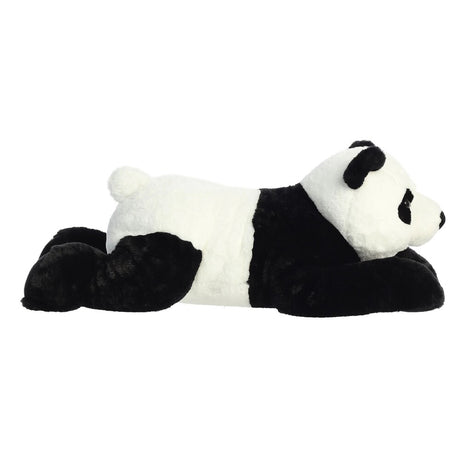 Plush panda toy lying down on a white background