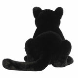 Black plush toy sitting on a white background
