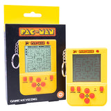 Yellow Pac-Man game keychain with packaging on a white background