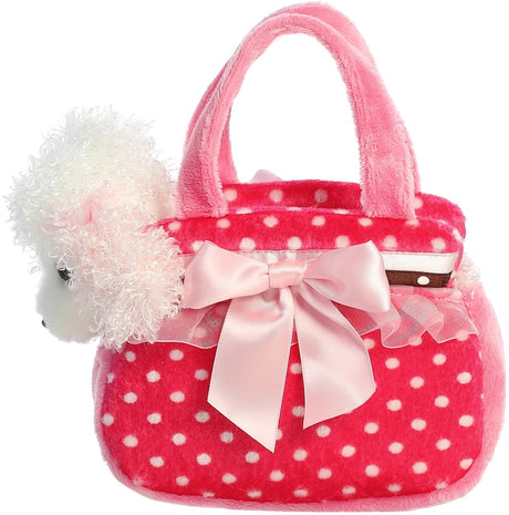 Pink polka dot handbag with a white fluffy dog toy and pink bow on a white background