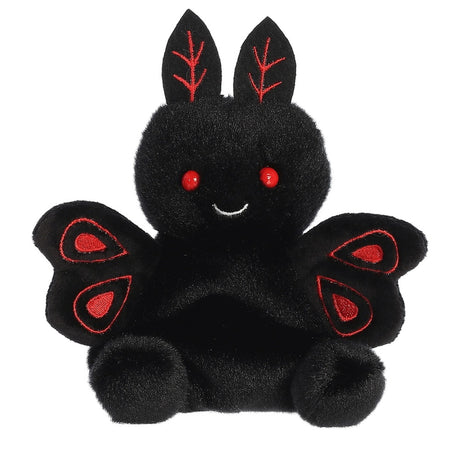 Black plush toy with red accents on a white background