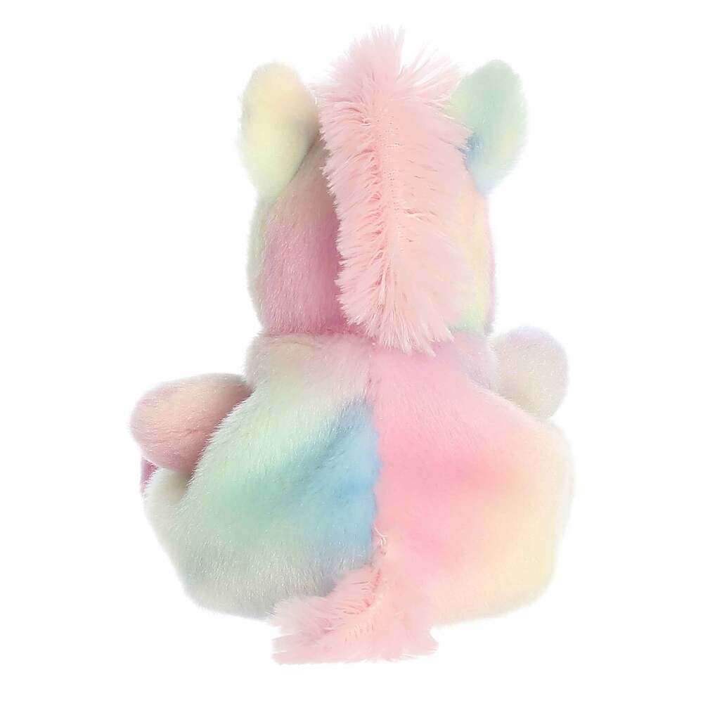 Pastel-colored plush unicorn on a white background