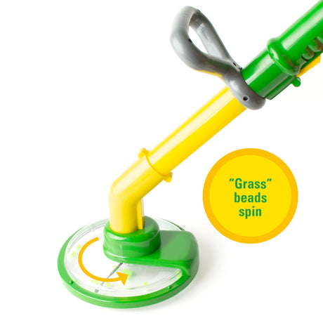 Green and yellow John Deere Weed Trimmer Toy with a label indicating 'Grass beads spin' on a white background