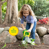 Child playing with a John Deere Hedge Trimmer Toy in a natural setting