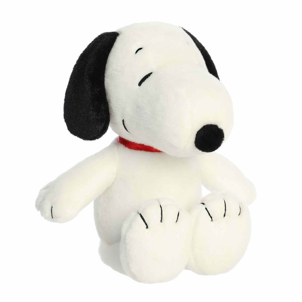 Plush toy of a black and white dog with a red collar on a white background
