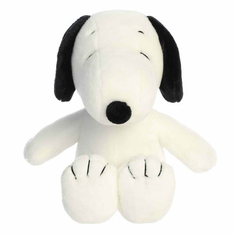 Plush toy resembling a black and white dog on a white background