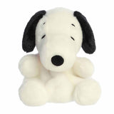 Plush toy of a black and white dog on a white background