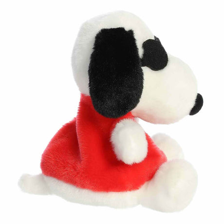 Plush toy of a dog in a red outfit on a white background