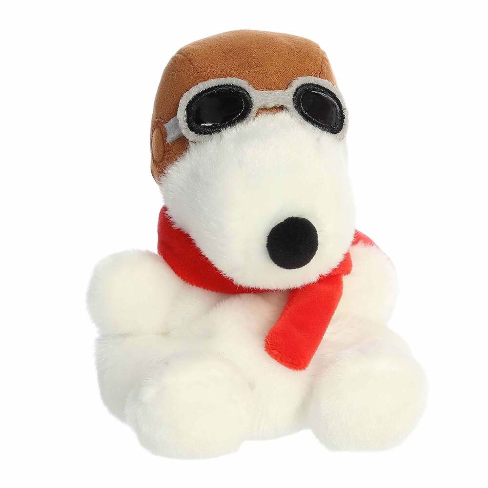 Plush dog toy with goggles and a red scarf on a white background