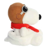 Plush dog toy with a brown helmet and red scarf on a white background