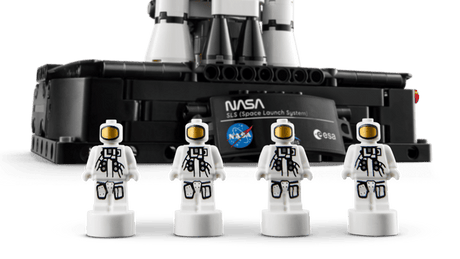 LEGO Technic: NASA Artemis Space Launch System Rocket with four astronauts in front on a transparent background