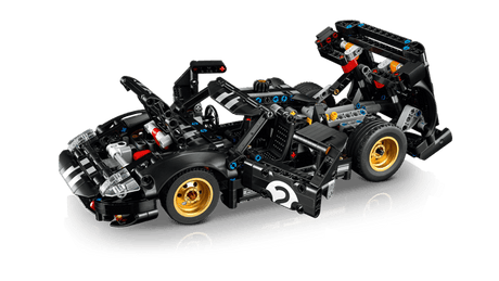 Black LEGO Technic: 1966 Ford GT40 MKII Race Car with gold wheels on a transparent background