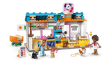 LEGO Friends: Dog Treats Bakery with a colorful building, characters, and various items on a transparent background
