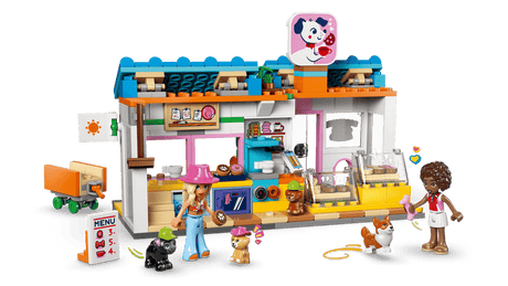 LEGO Friends: Dog Treats Bakery with a colorful building, characters, and various items on a transparent background
