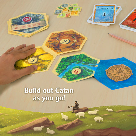 Board game setup with cards and a landscape illustration, featuring text 'Build out Catan as you go!'.