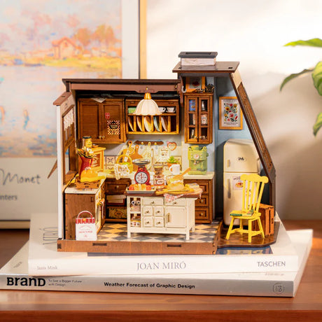 Miniature model of a Baking Kitchen set on top of a book