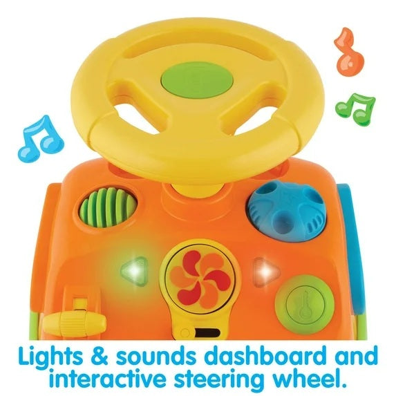 Toy dashboard with steering wheel, buttons, and lights on a white background
