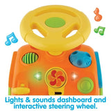 Toy dashboard with steering wheel, buttons, and lights on a white background