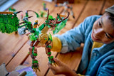 Child playing with a green LEGO Ninjago: The Dragon of Life on a wooden table