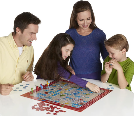 Family playing Scrabble Junior board game together on a white background