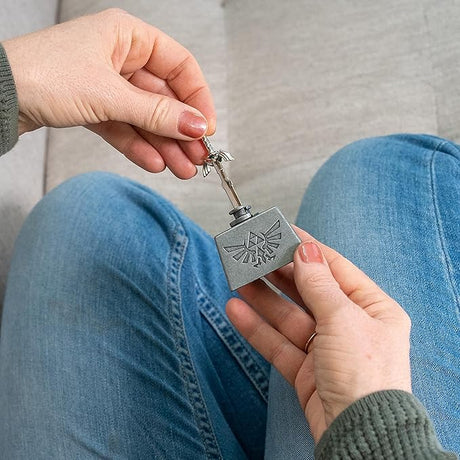 Person holding a Puzzle: Hanayama: Zelda Master Sword Level 6