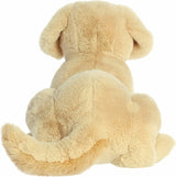 Beige plush dog toy on a white background