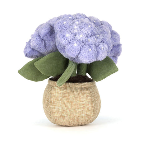Stuffed Amuseables Hydrangea with purple flowers and green leaves in a beige pot on a white background