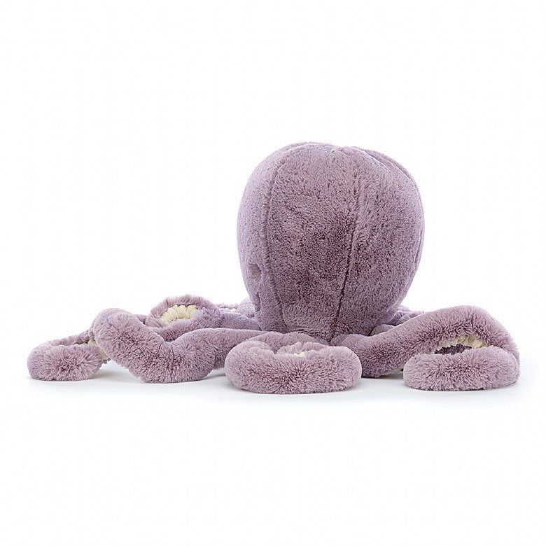 Side view of a plush purple Maya Octopus Large toy  on a white background