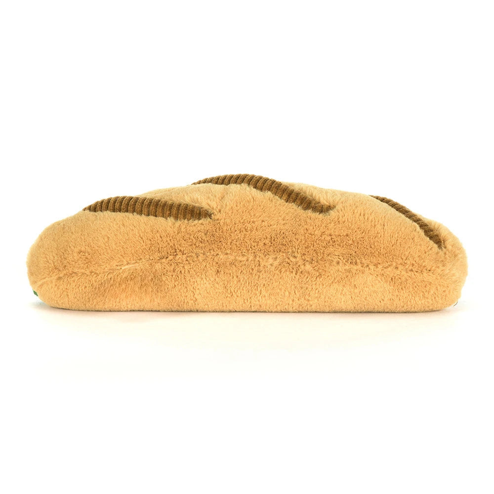 Rear view of a Amuseables Caprese Baguette on a white background