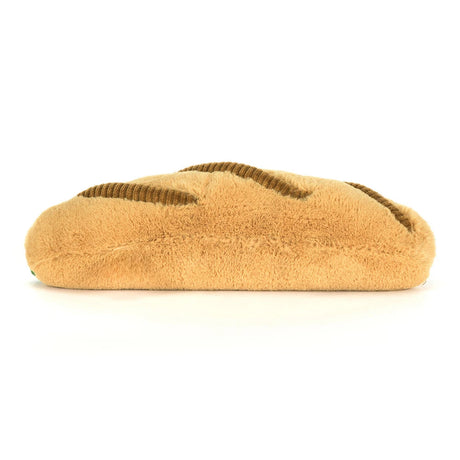 Soft and plush toy shaped like a baguette with textured brown details, designed as the Amuseables Caprese Baguette for imaginative play.