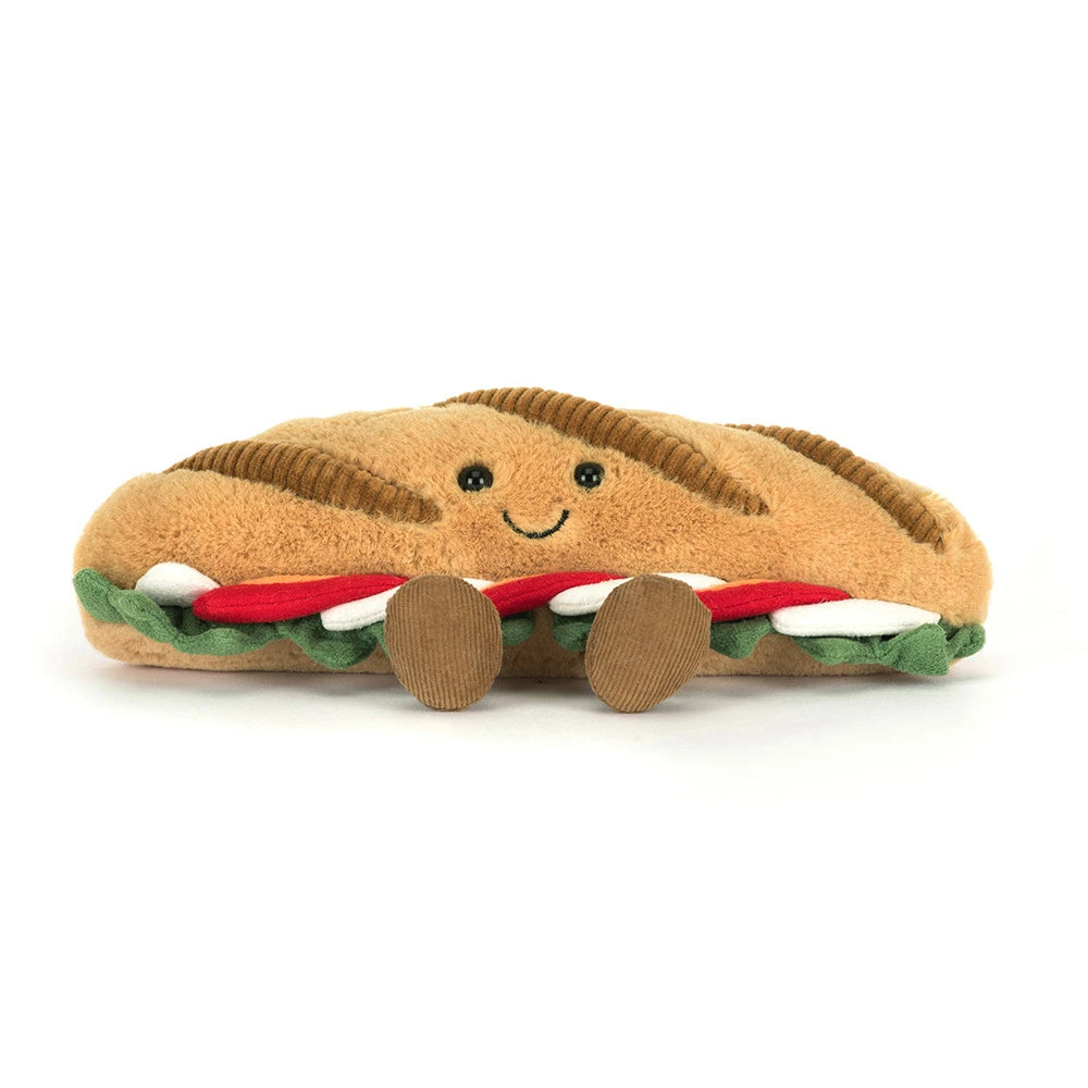 Plush toy Amuseables Caprese Baguette with a smiling face on a white background