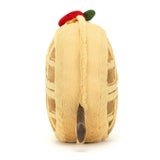 Side view of a soft, plush toy designed as a waffle with a red strawberry on top, named Amuseables Rene Waffle, perfect for kid's birthday gifts.