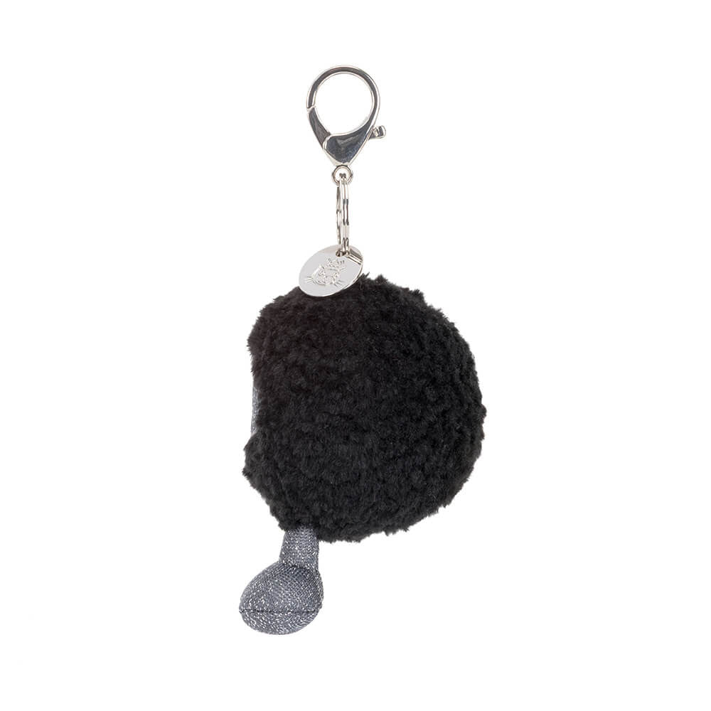 Side view of a Amuseables Black Hole Bag Charm with a silver tag on a white background