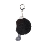 Side view of a Amuseables Black Hole Bag Charm with a silver tag on a white background